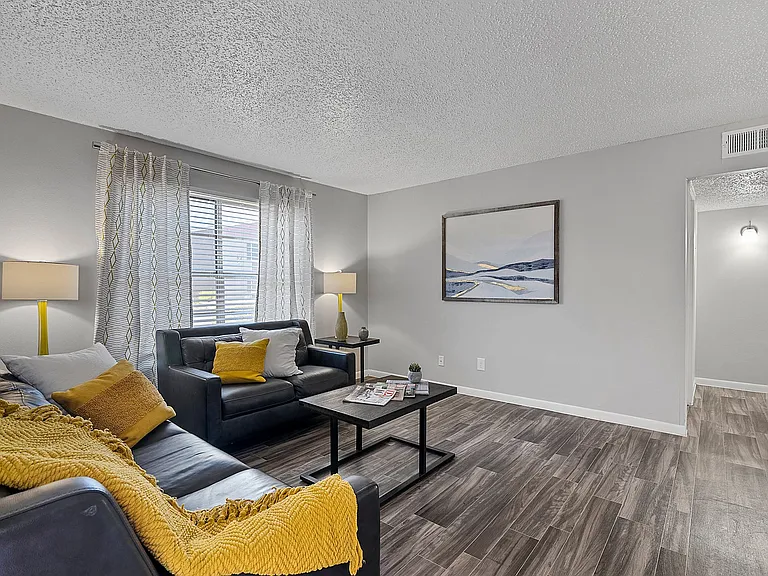 Spacious living area with warm finishes and beautiful natural light.