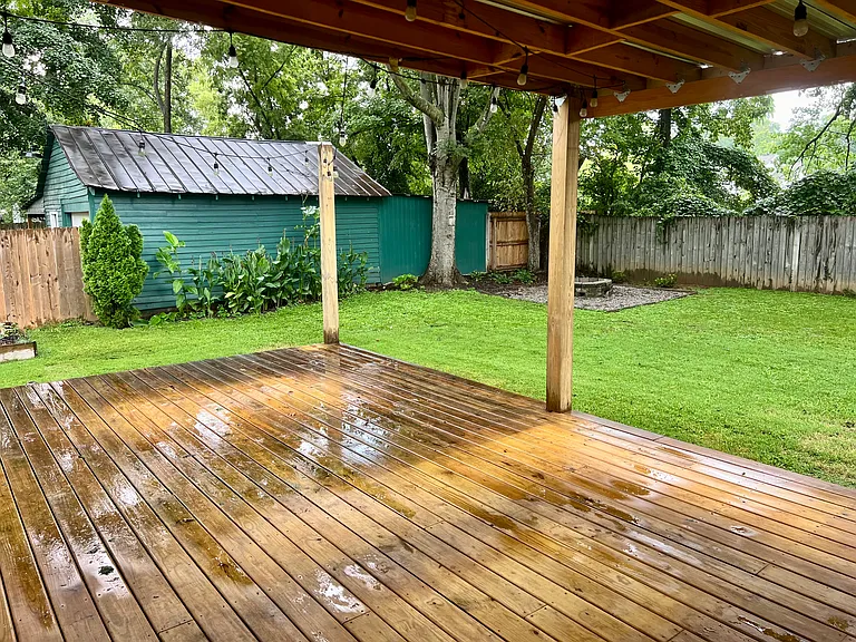 Back Porch. Half is covered coming out French doors from master bedroom