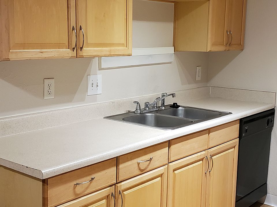 Updated galley kitchen with sink, disposal, RO unit, and dishwasher