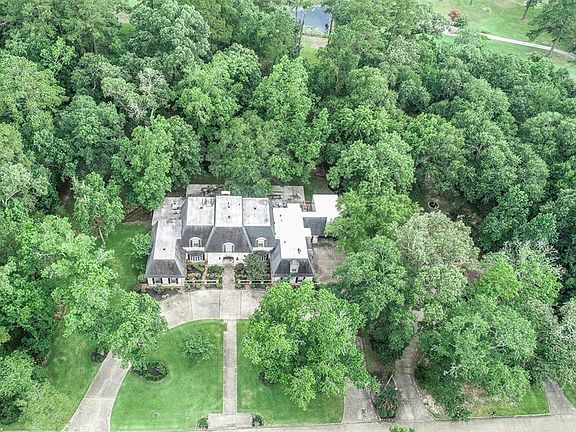The aerial shots shows off how it's nestled against mature trees for a tranquil setting.