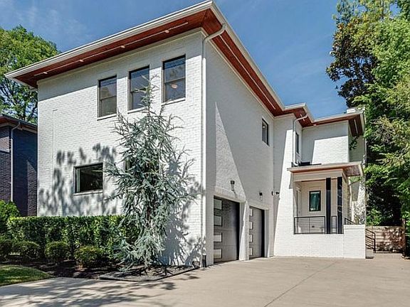 Driveway and entrance to garage and front entrance. Additional outside parking is just to the left of this photo.