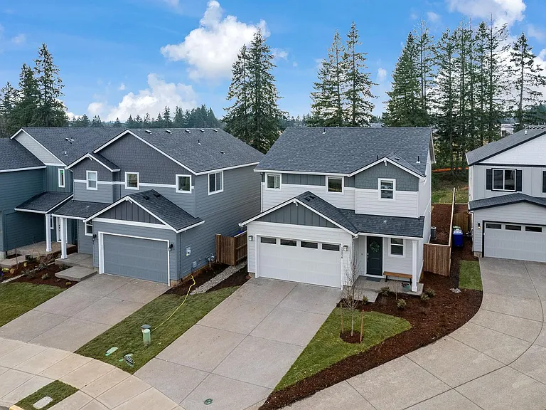 house is the one with white garage and straight driveway. Nice neighbors on either side!