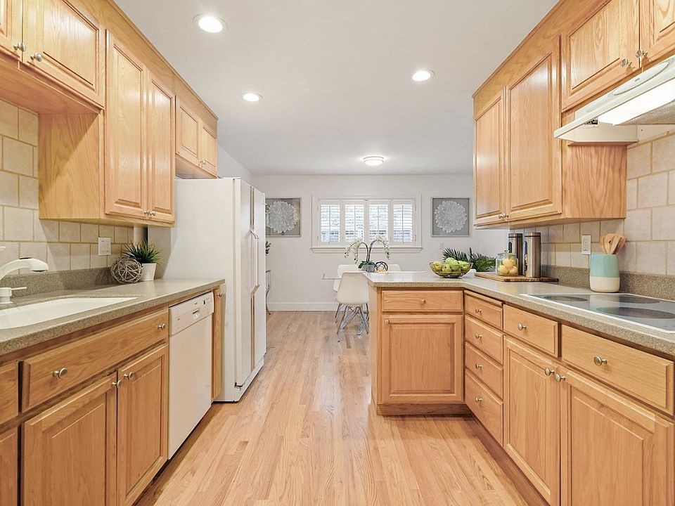 Kitchen: appliances (fridge, dishwasher, stove, microwave) included, staging items not included.