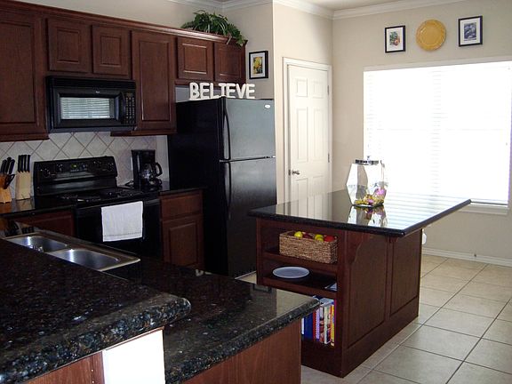 Spacious kitchen with center island and huge breakfast bar