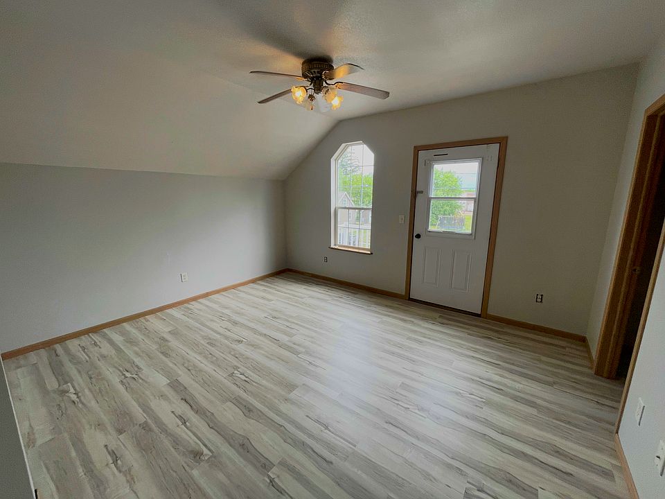 Spacious primary bedroom with natural light and plenty of room for a full bedroom furniture set.