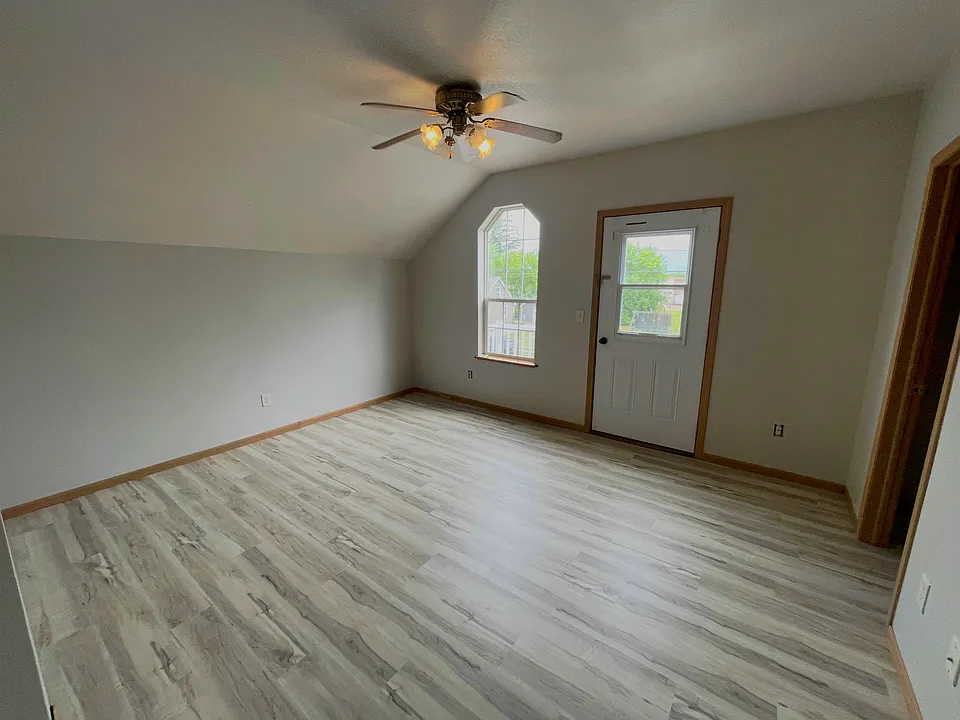 Spacious primary bedroom with natural light and plenty of room for a full bedroom furniture set.