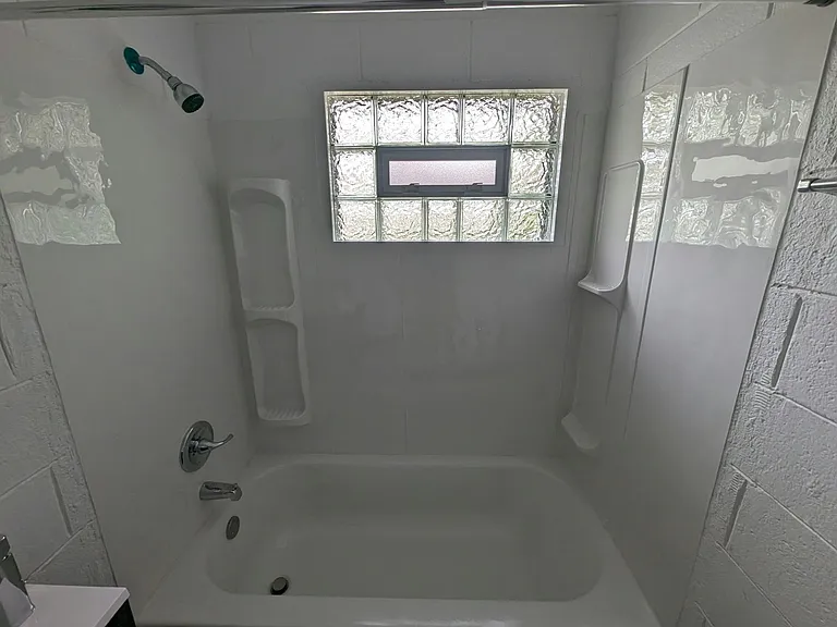 full bathtub, operable block glass window