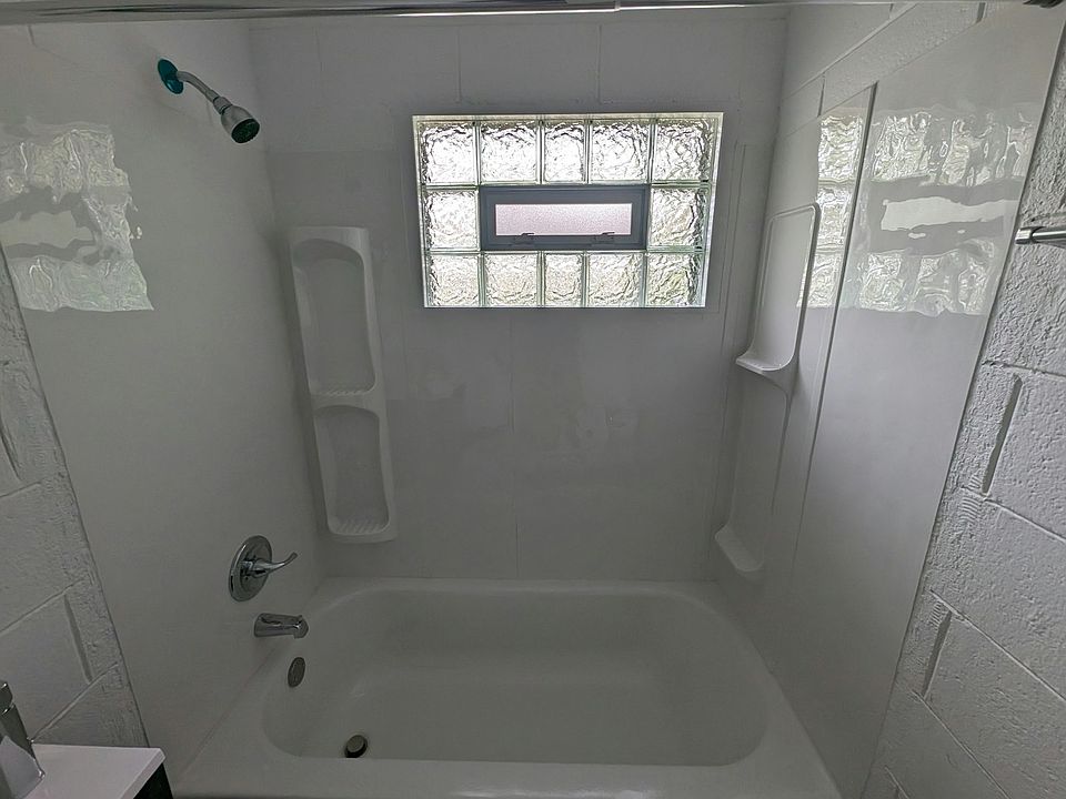full bathtub, operable block glass window