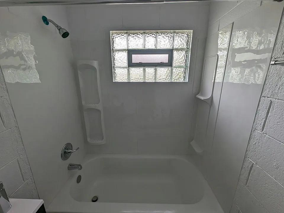 full bathtub, operable block glass window