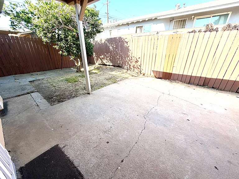 Large fenced in back yard. There is a old storage building
