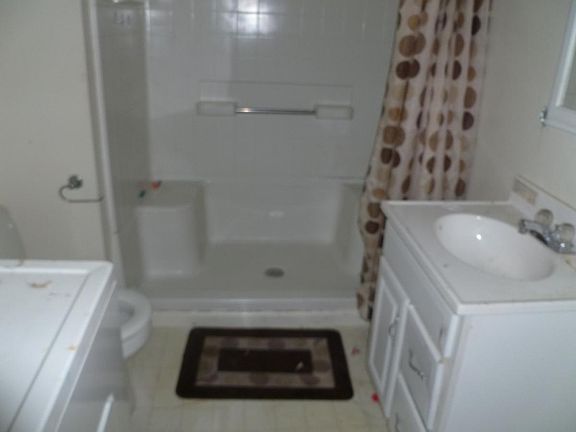 DOWNSTAIRS BATHROOM WITH UTILITY ROOM