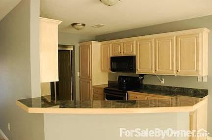 View into Kitchen from living room area
						:
						Open floor plan designe allows for views into livingroom from kitchen.
