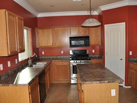 Look at those countertops! Walk in pantry!
