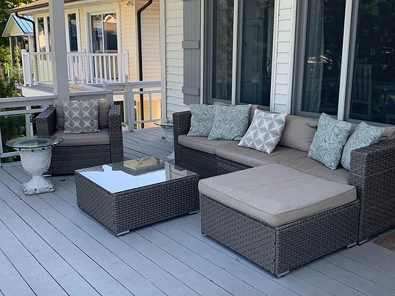 Deck off the kitchen and family room looking out to the back yard and Spring Lake.