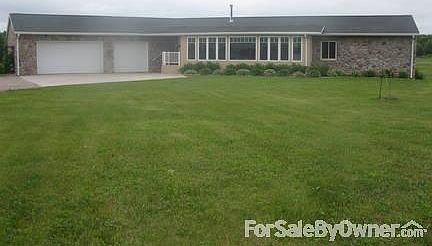 Ranch with Fieldstone Exterior
						:
						Three car insulated garage.