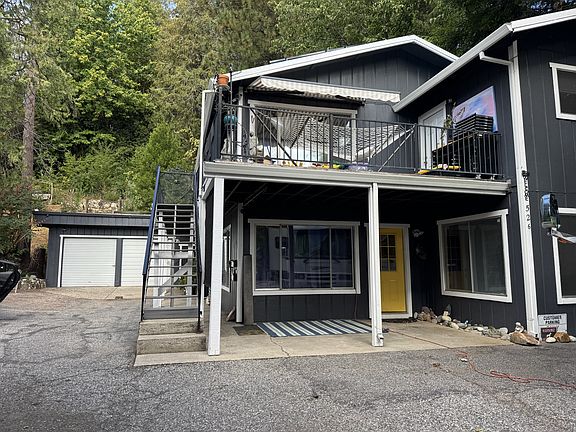 Unit is the yellow door on the first level.