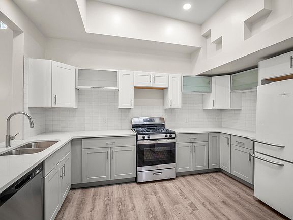 Fully renovated kitchen with new cabinets, dishwasher, stove, and microwave to be added soon! Lots of natural light from the skylights + unique architecture!