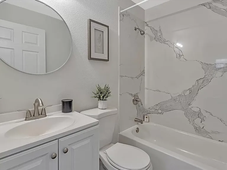 Upgraded bathroom with a bathtub.