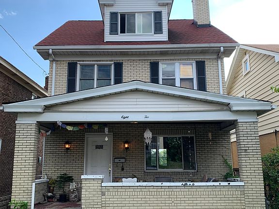 A red roof house with lots of characters and updates.
Front view: leveled front yard