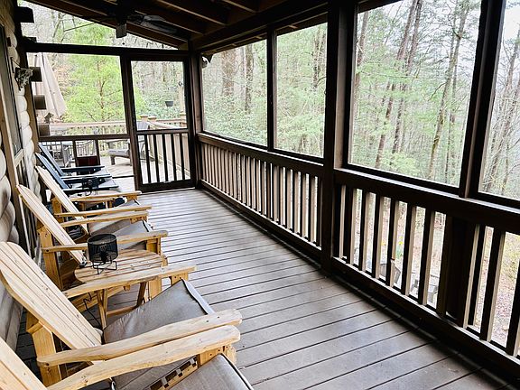 Large Screened in porch overlooking lake and wooded area