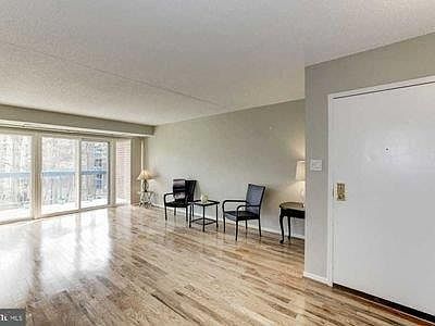 Spacious living room with hardwood floors.