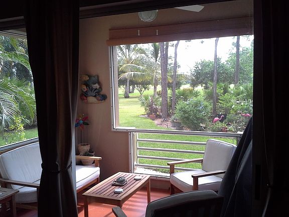 Lanai overlooking rear property that overlooks golf course.