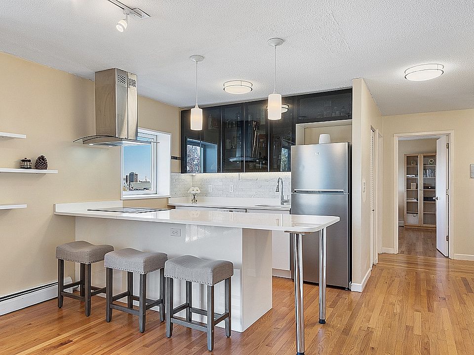 High End Kitchen with Directly Vented Hood; Quartz Countertop, Marble Backsplash, Bosh Oven and Induction Cook Top