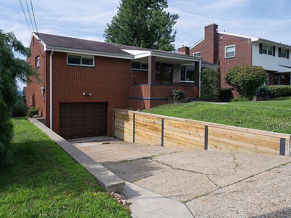 One car garage, driveway way and on-street parking pad