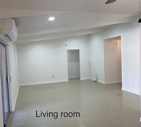 Living Room with entrance from front patio and exit to back patio.