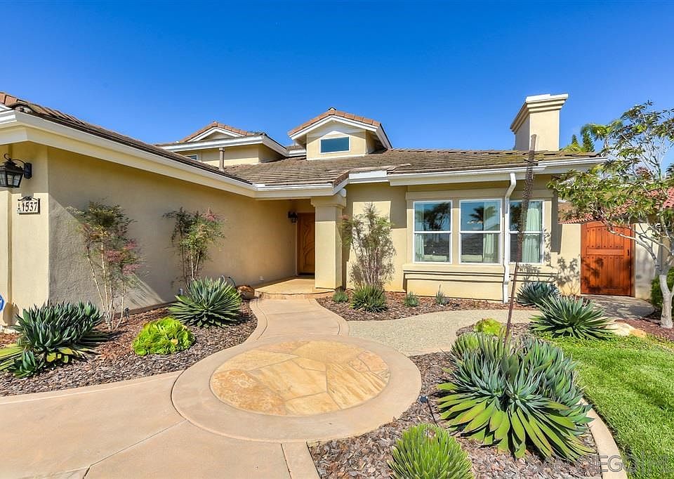 Hand carved double doors.  Flagstone walkway.