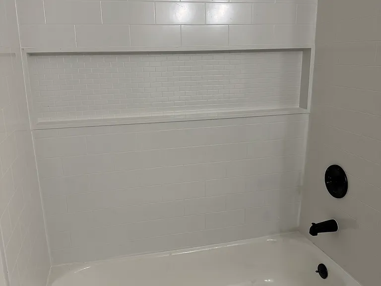 Brand new tub and shower with built in shelf