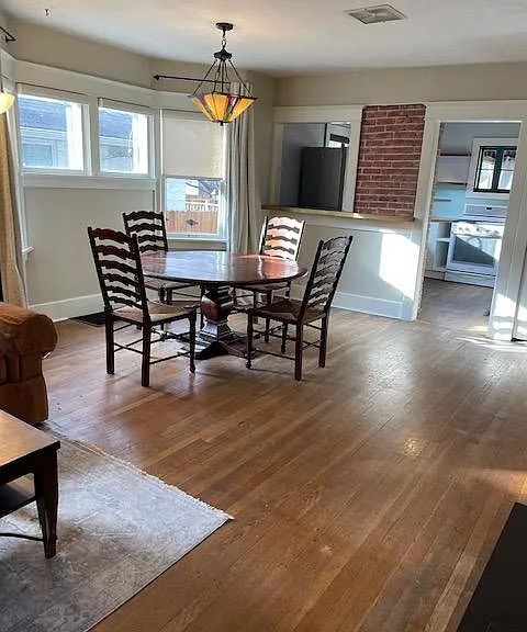 Furnished dining room table with Stickley type ceiling lamp adds tons of charm!