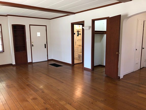 Looking toward front door large coat closet and dining area