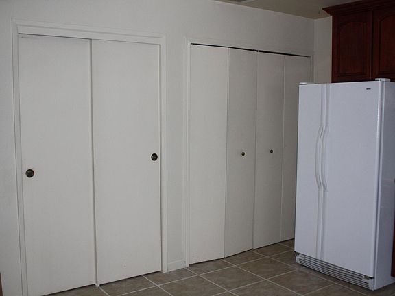 Pantry on the left, washer/dryer on the right