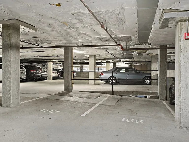 Two side-by-side parking spaces in the gated garage. These are the closest parking spaces to the elevator!