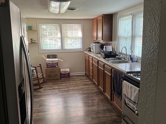 A small dining set will fit in the corner at the end of the room near the windows.