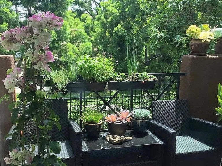 Balcony overlooking green space.