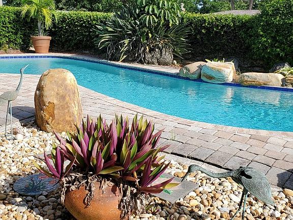Discover your own private oasis_ a beautifully maintained pool surrounded by tranquil privacy.