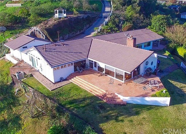 Panoramic views are available from this gorgeous 6 bedroom 3 bathroom home situated on its own promontory in the private gated city of Rolling Hills.