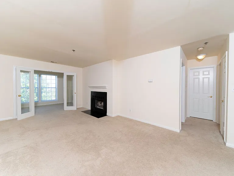 Plush carpeting in living areas and wood-burning fireplace