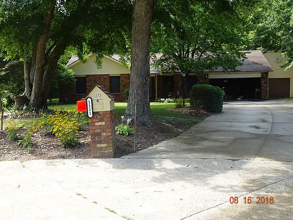 Front view with 3 car garage