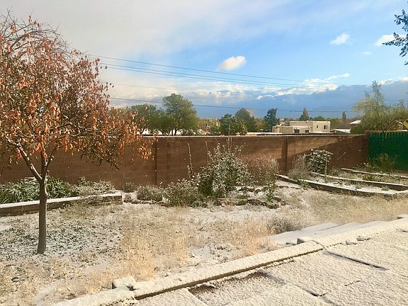 Spacious back yard with large flagstone terrace patio.