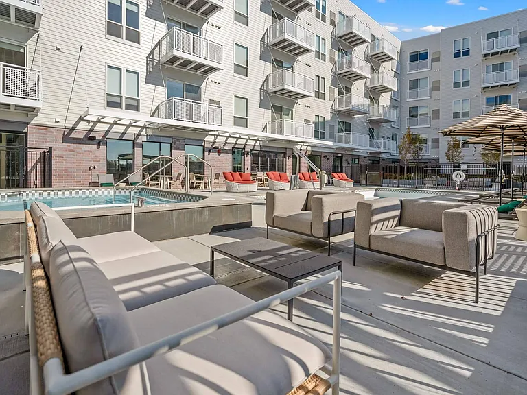 Poolside lounge on the rooftop amenity deck at The Hallon Luxury Apartments in Hopkins MN