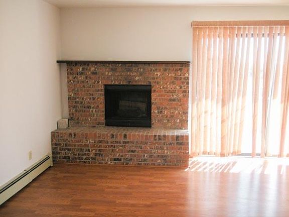 Fireplace in living room with sliding glass door