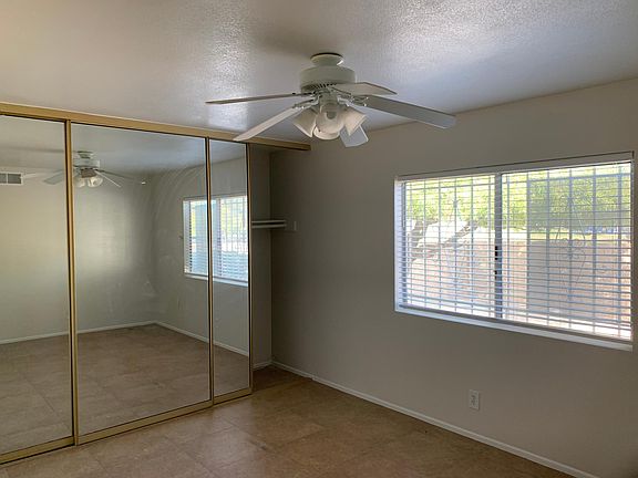 Master Bedroom three fully mirrored closet doors on one wall