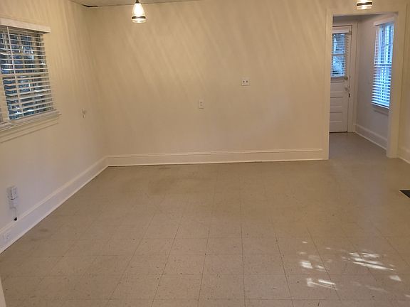 Living room with entrance to kitchen
