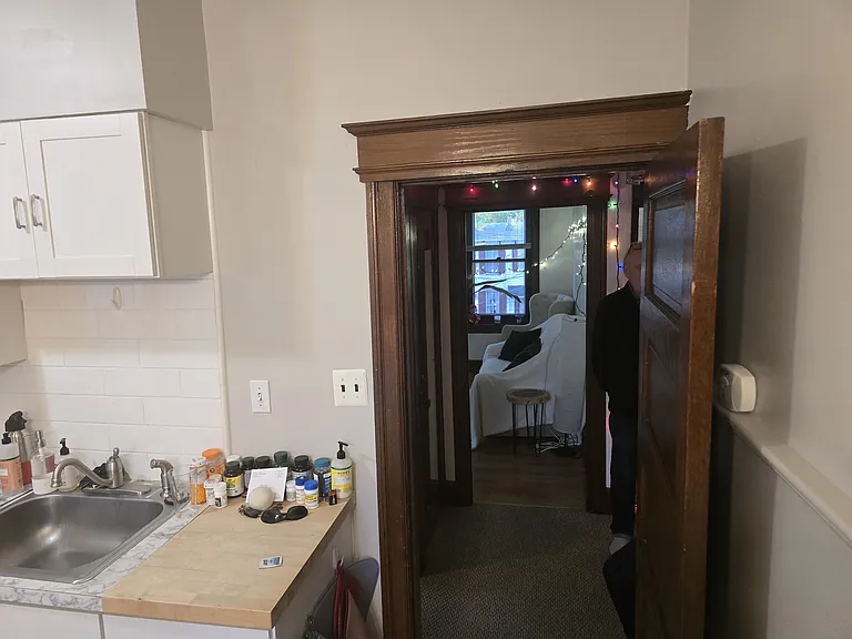 Kitchen Table view to Door/Foyer and Family Room across the Foyer