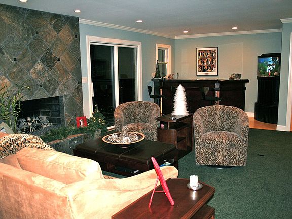 View of Fam Room fireplace & bar seating areas