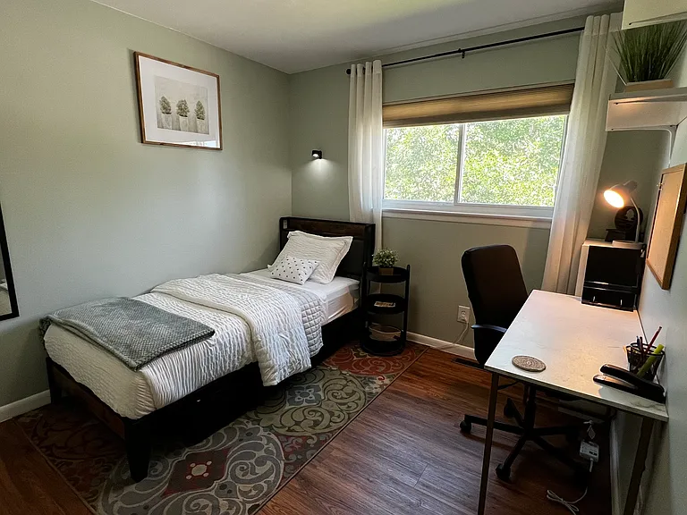 Quiet bedroom with a Twin XL bed and dedicated workspace, ideal for remote work or study.