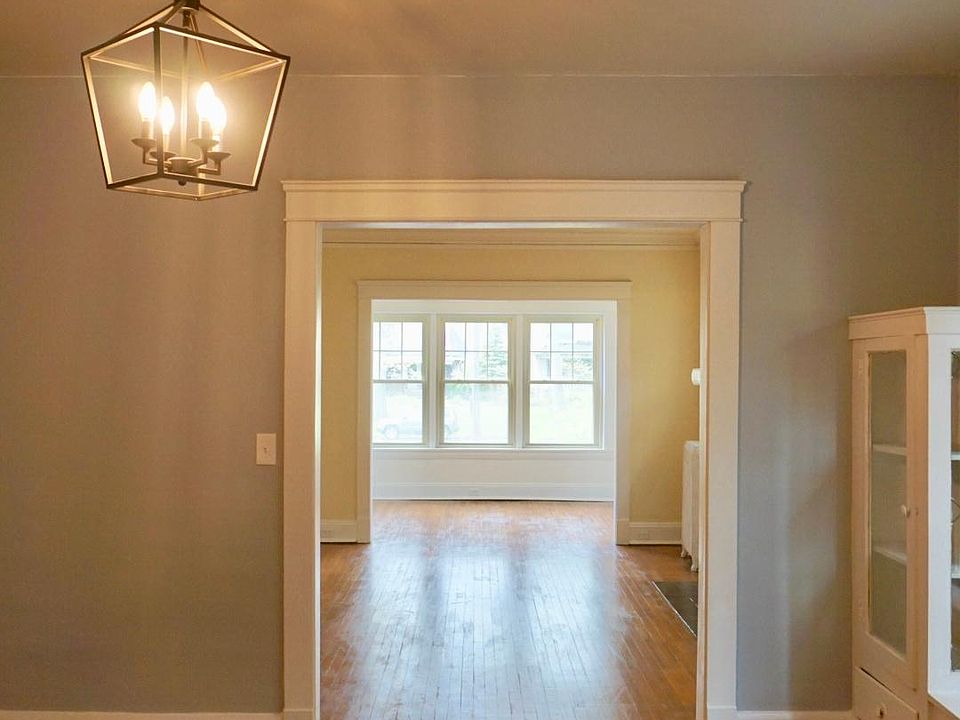 open concept dining room, living room, and sunroom